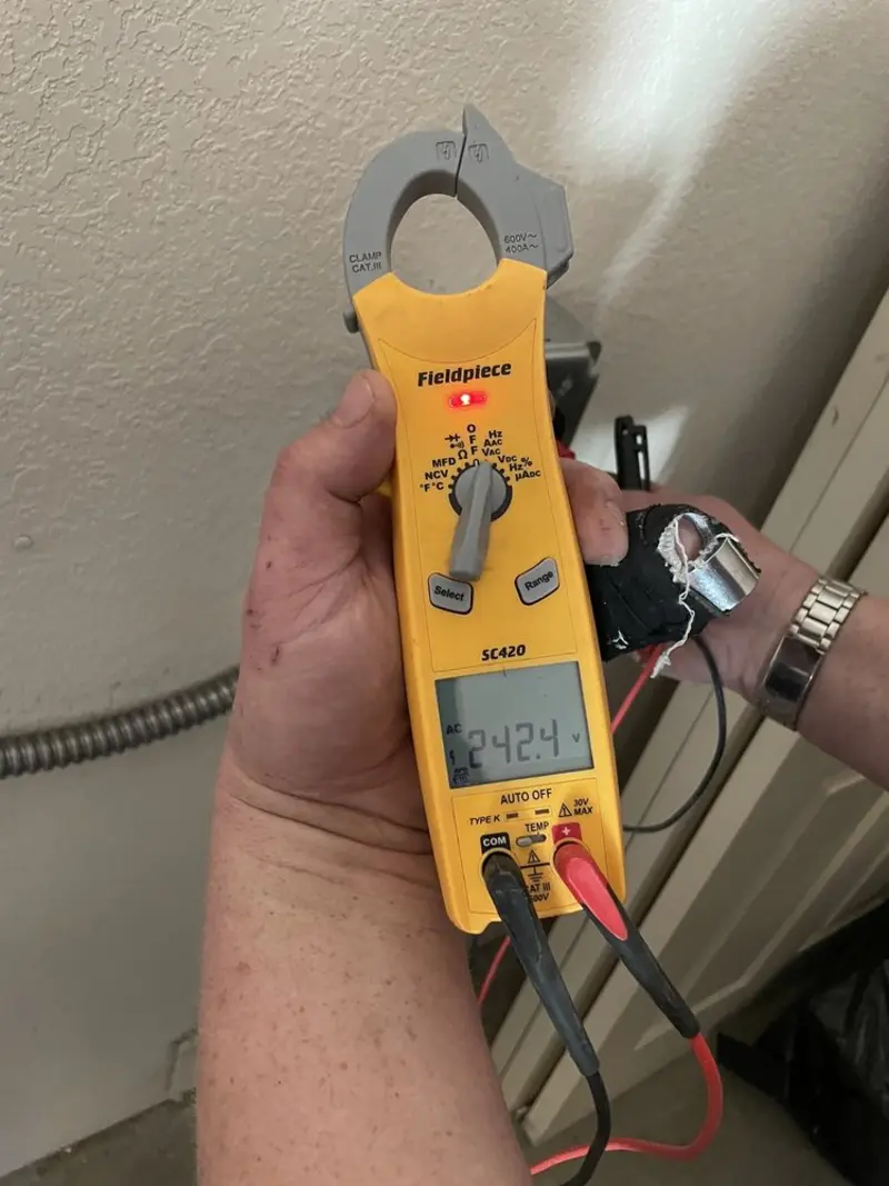 Voltage testing with clamp meter during Outlet Installation in Eaton Rapids